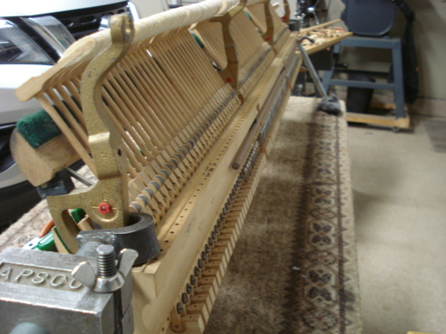 3 - ACTION IN PIANO SHOP Action on bench, dampers & rails removed.